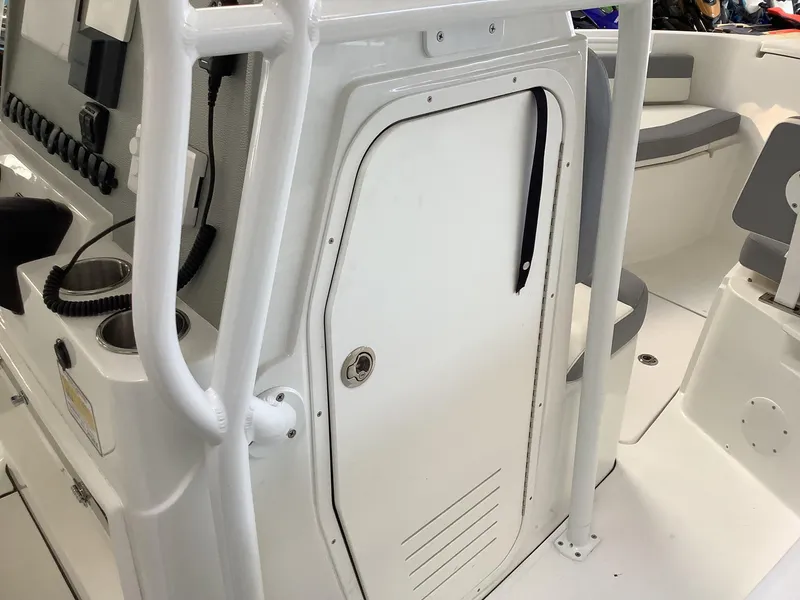 Slide: The Image of 2025 Release 210RX Center Console interior with white door and seating area. - 29
