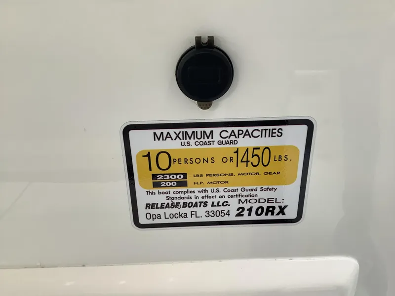 Slide: The Image of 2025 Release 210RX Center Console boat capacity label, 10 persons or 1450 lbs maximum. - 32