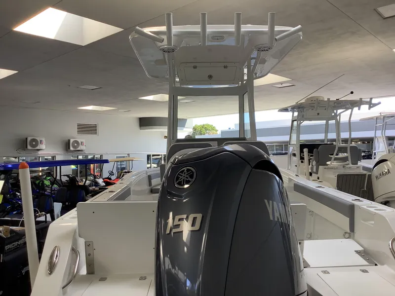 Slide: The Image of 2025 Release 210RX Center Console boat with Yamaha engine in showroom. - 6