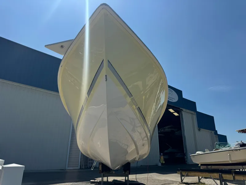 Slide: The Image of 2006 Jupiter 31 CC boat docked, calm waters. - 3