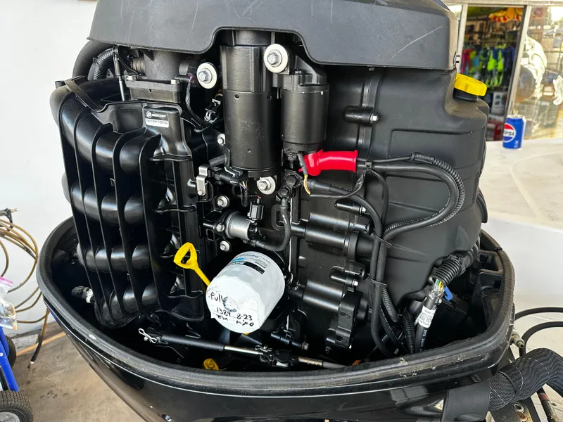Slide: The Image of 2021 Bayliner VR6 Bowrider OB outboard engine, detailed view of components and wiring. - 16
