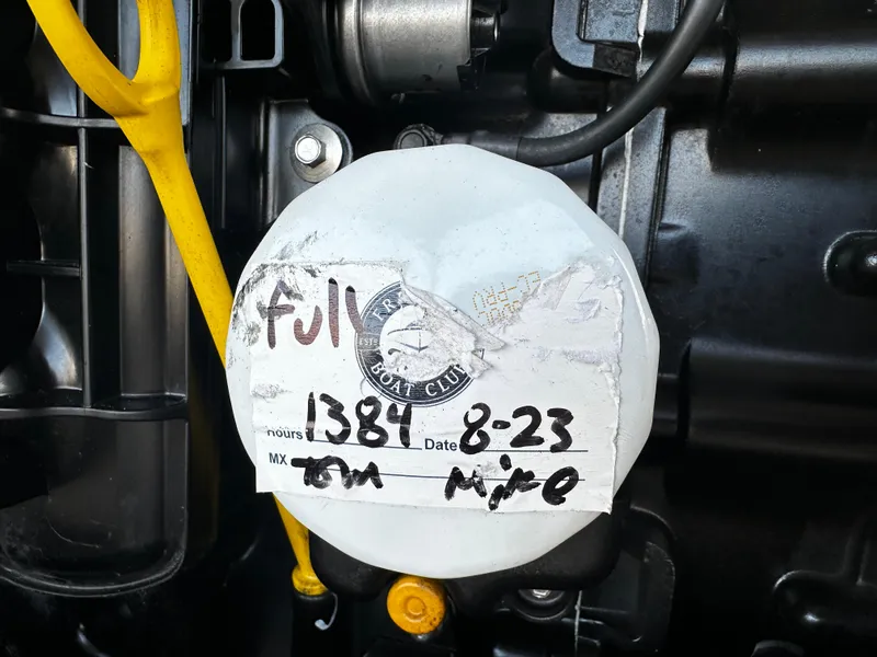 Slide: The Image of Engine compartment of 2021 Bayliner VR6 Bowrider OB with maintenance label. - 17