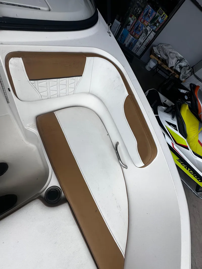 Slide: The Image of 2021 Bayliner VR6 Bowrider OB interior with tan and white seating. - 25