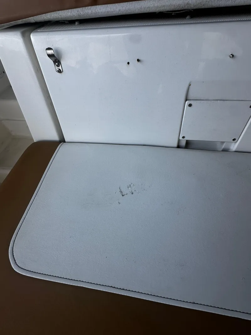 Slide: The Image of 2021 Bayliner VR6 Bowrider OB interior detail with white and brown seating. - 29