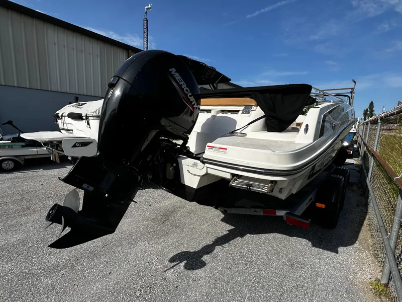 Slide: The Image of 2021 Bayliner VR6 Bowrider OB with Mercury outboard engine, parked outdoors. - 5