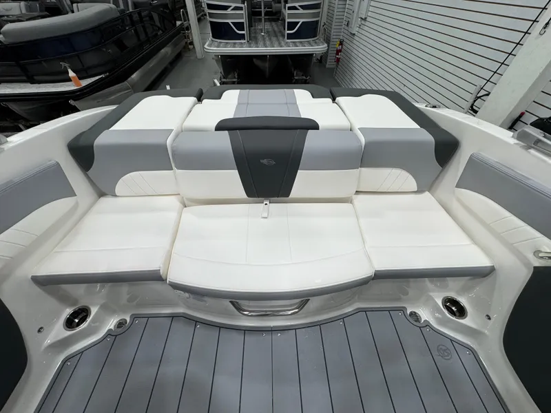 Slide: The Image of 2025 Chaparral 21 SSi boat interior with gray and white seating and modern design. - 10