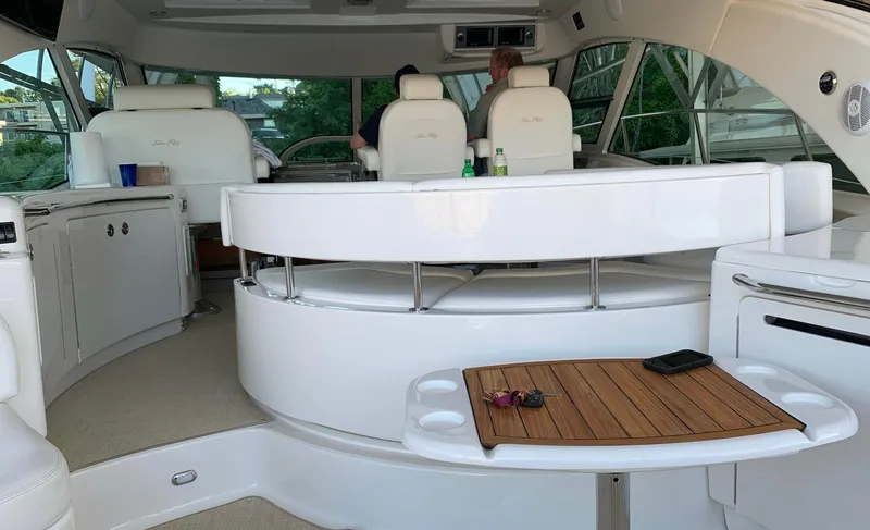 Slide: The Image of 2008 Sea Ray 550 Sundancer yacht interior with seating and helm station. - 15