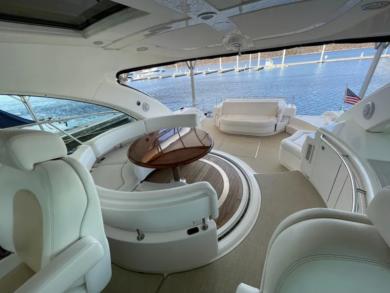 Slide: The Image of Luxurious interior of 2008 Sea Ray 550 Sundancer yacht with elegant seating and scenic water view. - 16