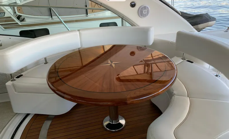 Slide: The Image of Luxurious seating area on 2008 Sea Ray 550 Sundancer yacht with elegant wooden table. - 17