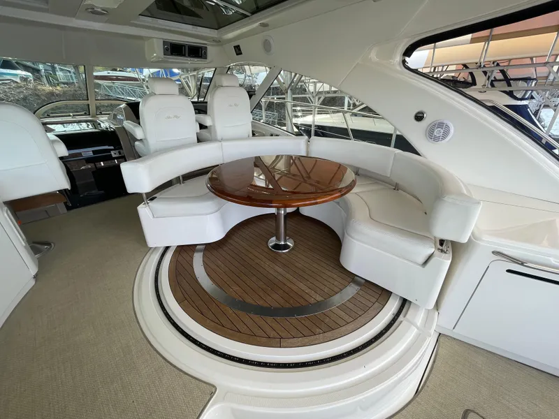 Slide: The Image of Luxurious 2008 Sea Ray 550 Sundancer yacht interior with elegant seating and wooden table. - 18