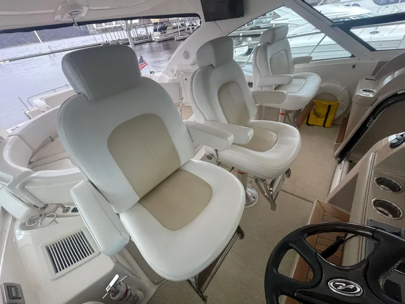 Slide: The Image of Luxurious 2008 Sea Ray 550 Sundancer yacht interior with plush seating and helm. - 30