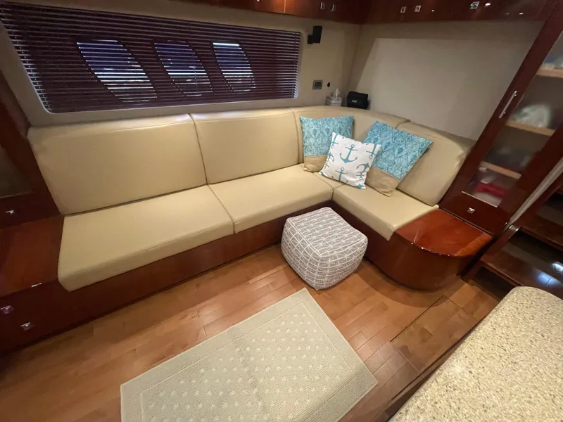 Slide: The Image of Luxurious interior of 2008 Sea Ray 550 Sundancer yacht with beige seating and nautical decor. - 34