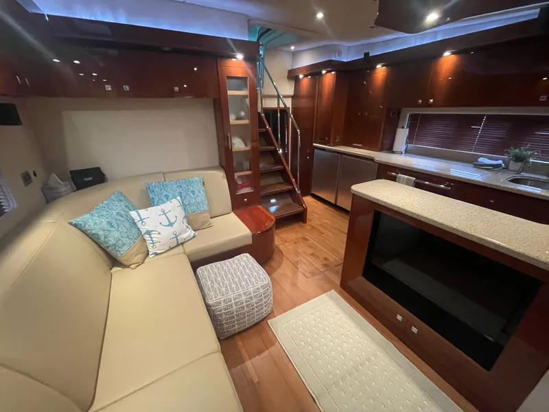 Slide: The Image of Luxurious interior of 2008 Sea Ray 550 Sundancer yacht with modern kitchen and cozy seating area. - 35