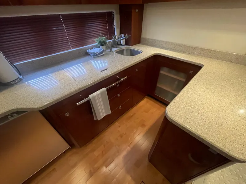 Slide: The Image of Luxurious kitchen interior of 2008 Sea Ray 550 Sundancer yacht with modern amenities. - 38