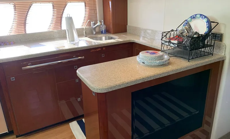 Slide: The Image of Luxurious kitchen interior of 2008 Sea Ray 550 Sundancer yacht with modern amenities. - 39