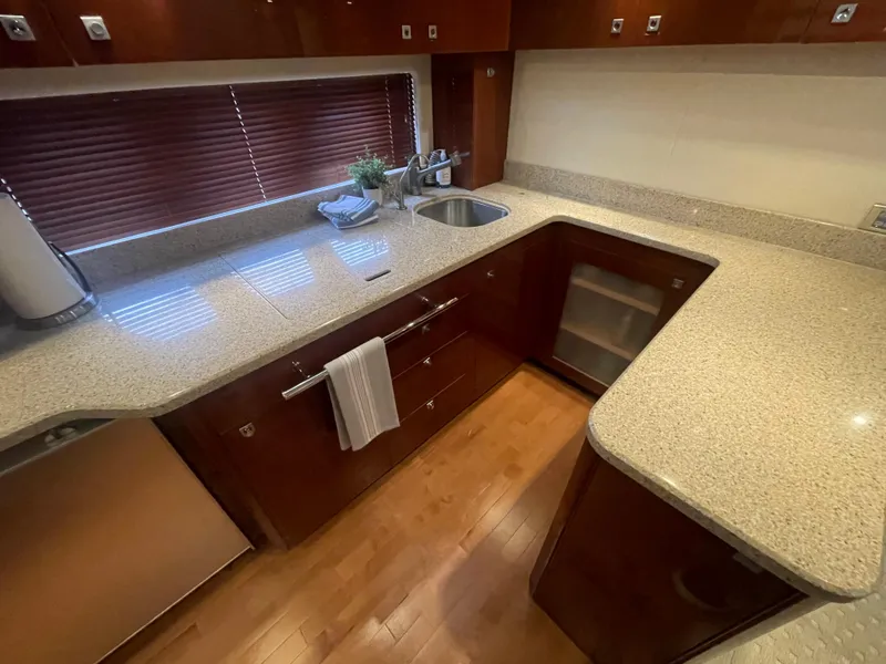 Slide: The Image of Luxurious kitchen interior of 2008 Sea Ray 550 Sundancer yacht with modern amenities. - 41