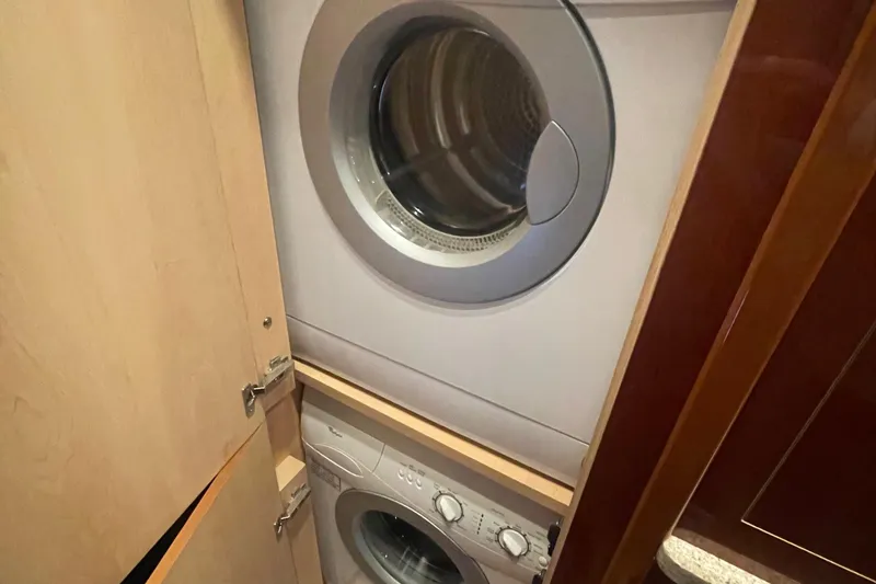 Slide: The Image of Stacked washer and dryer inside 2008 Sea Ray 550 Sundancer yacht. - 43