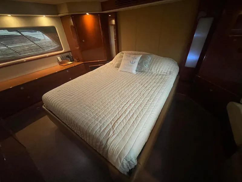 Slide: The Image of Luxurious bedroom interior of 2008 Sea Ray 550 Sundancer yacht with cozy bed. - 44