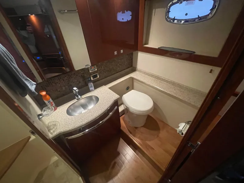 Slide: The Image of Luxurious bathroom in 2008 Sea Ray 550 Sundancer yacht with modern fixtures and wood flooring. - 49