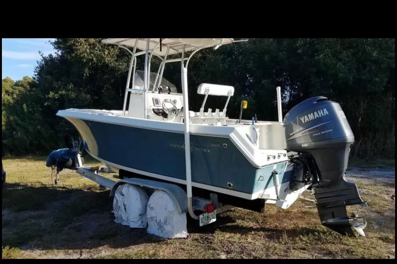 Slide: The Image of 2009 Sailfish 218 CC boat with Yamaha outboard motor on a trailer. - 6