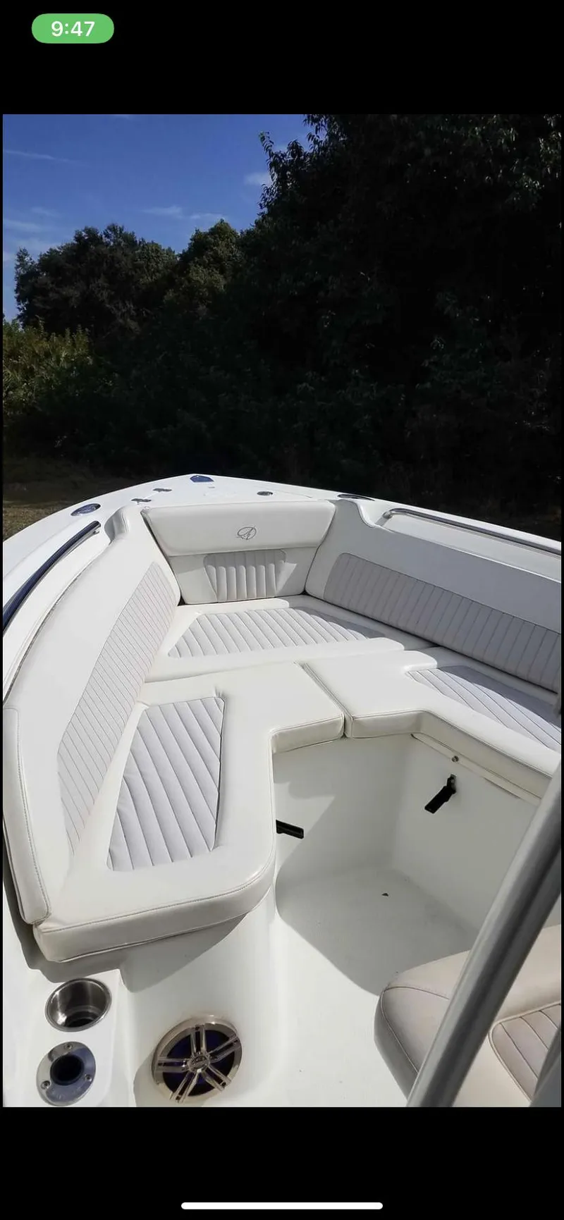 Slide: The Image of 2009 Sailfish 218 CC boat interior with cushioned seating and cup holders. - 7