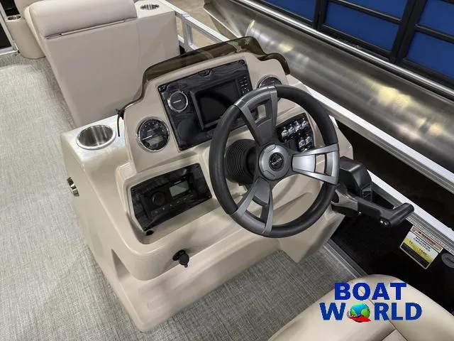 Slide: The Image of 2025 Tahoe Sport 2385 boat console with steering wheel and controls, featuring Honda 4-Stroke EFI. - 13