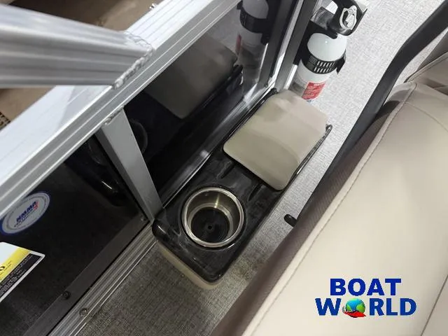 Slide: The Image of Interior of 2025 Tahoe Sport 2385 boat with cup holder and fire extinguisher. - 16