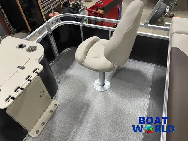 Slide: The Image of 2025 Tahoe Sport 2385 Rear Fish boat interior with swivel chair and fishing station. - 18