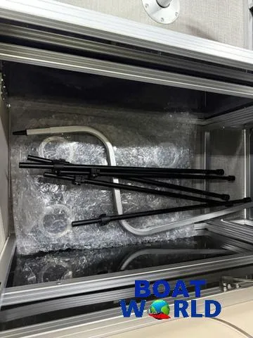 Slide: The Image of 2025 Tahoe Sport 2385 Rear Fish boat parts in packaging at Boat World. - 22