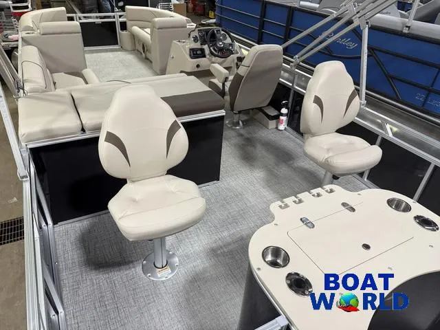Slide: The Image of 2025 Tahoe Sport 2385 Rear Fish boat interior with seating and control console. - 23