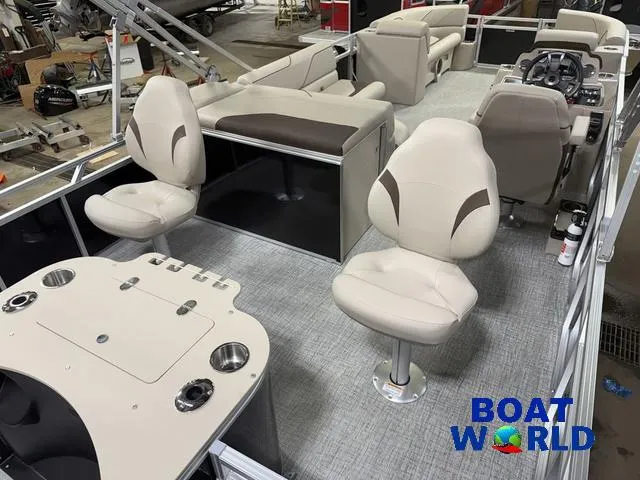 Slide: The Image of 2025 Tahoe Sport 2385 Rear Fish boat interior with seating and control console. - 24