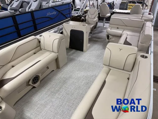 Slide: The Image of 2025 Tahoe Sport 2385 Rear Fish boat interior with beige seating and modern design. - 25
