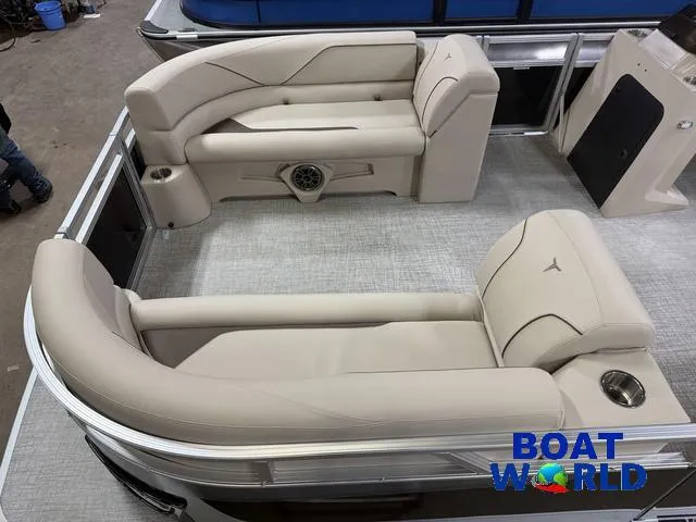 Slide: The Image of 2025 Tahoe Sport 2385 boat interior with beige seating and "Boat World" logo. - 3