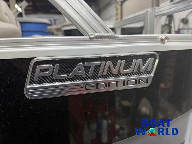 Slide: The Image of 2025 Tahoe Sport 2385 Platinum Edition boat badge at Boat World showroom. - 32