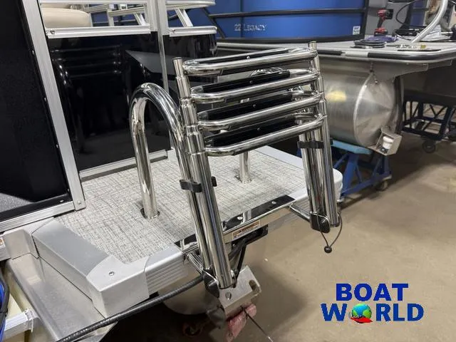 Slide: The Image of 2025 Tahoe Sport 2385 Rear Fish boat ladder, chrome finish, in showroom. - 39