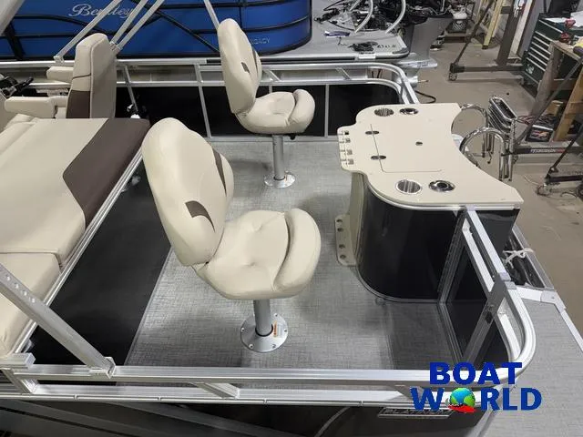 Slide: The Image of 2025 Tahoe Sport 2385 Rear Fish boat interior with seating and fishing station. - 5