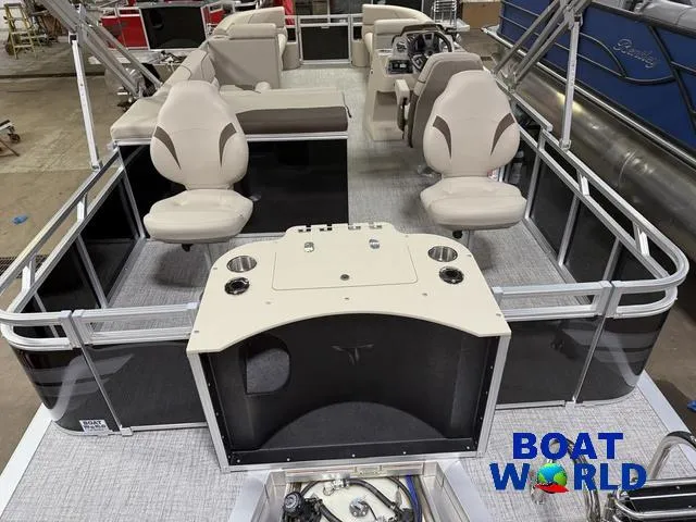 Slide: The Image of 2025 Tahoe Sport 2385 Rear Fish boat interior with seating and control panel. - 6