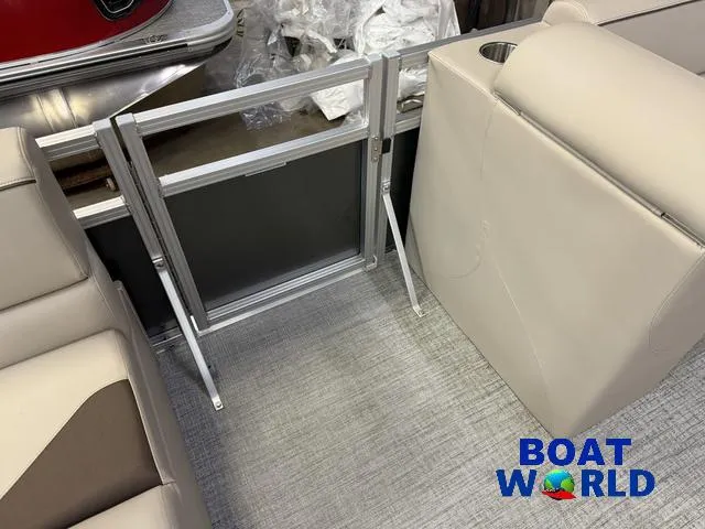 Slide: The Image of 2025 Tahoe Sport 2385 boat interior with foldable ladder and seating, Boat World logo visible. - 24