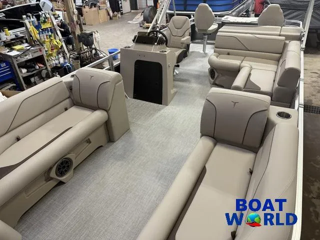 Slide: The Image of 2025 Tahoe Sport 2385 Rear Fish boat interior with beige seating and Honda 4-Stroke EFI engine. - 27