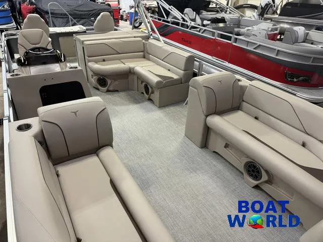Slide: The Image of 2025 Tahoe Sport 2385 Rear Fish boat interior with beige seating and modern design. - 28