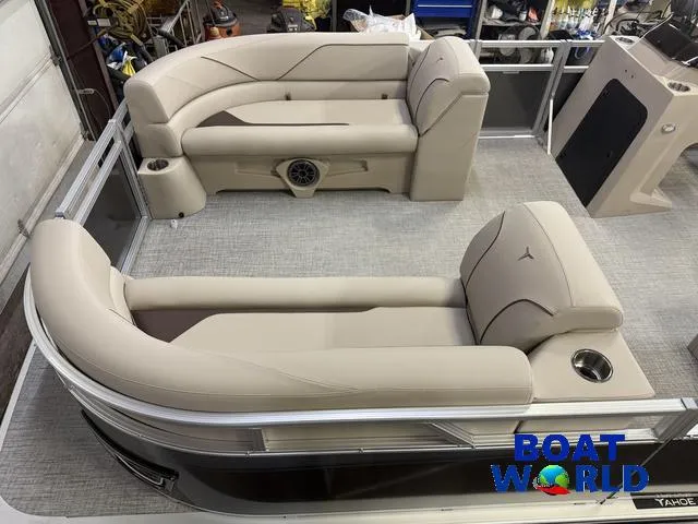 Slide: The Image of 2025 Tahoe Sport 2385 Rear Fish boat interior with beige seating and modern design. - 3