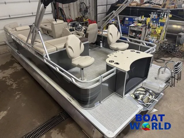 Slide: The Image of 2025 Tahoe Sport 2385 Rear Fish pontoon boat with Honda 4-Stroke EFI engine in a workshop. - 40