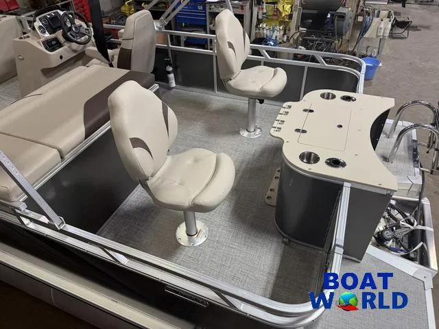 Slide: The Image of 2025 Tahoe Sport 2385 Rear Fish boat interior with seating and fishing station. - 5