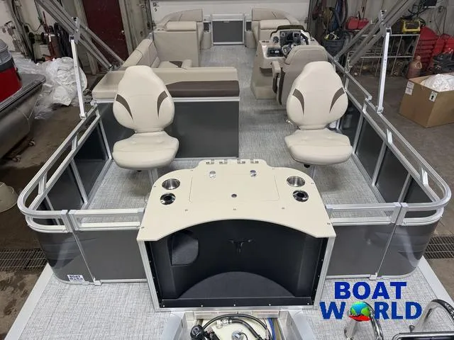 Slide: The Image of 2025 Tahoe Sport 2385 pontoon boat interior with seating and control console. - 6