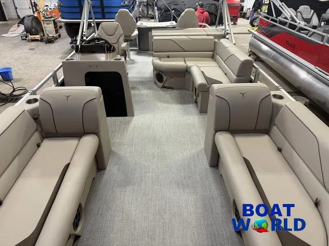 Slide: The Image of 2025 Tahoe Sport 2385 Rear Fish boat interior with beige seating, showcased at Boat World. - 7