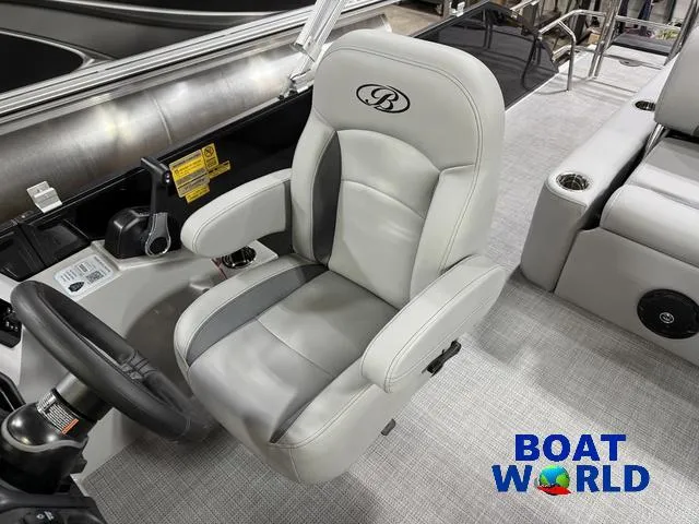 Slide: The Image of 2025 Bentley Pontoons Legacy 220 Swingback captain's chair, featuring luxurious gray upholstery. - 12