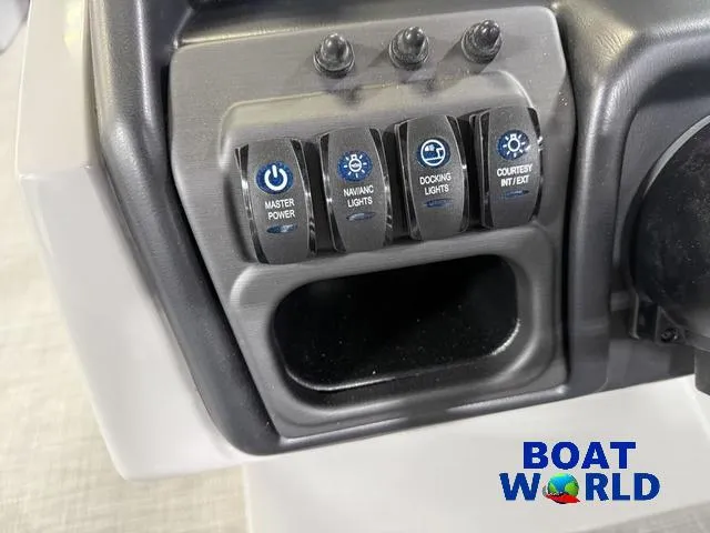 Slide: The Image of Control panel of 2025 Bentley Pontoons Legacy 220 with labeled switches for various boat functions. - 14