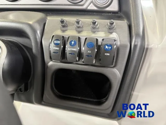 Slide: The Image of Control panel of 2025 Bentley Pontoons Legacy 220 Swingback with labeled switches. - 16