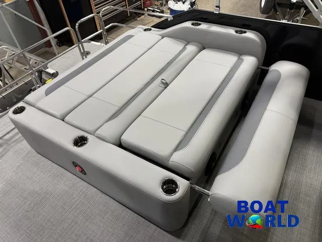 Slide: The Image of 2025 Bentley Pontoons Legacy 220 Swingback interior with gray seating and cup holders. - 21