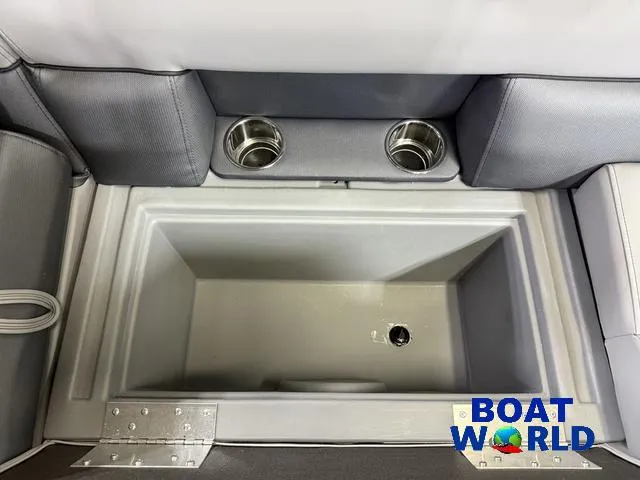 Slide: The Image of Interior of 2025 Bentley Pontoons Legacy 220 with cup holders and storage compartment. - 29